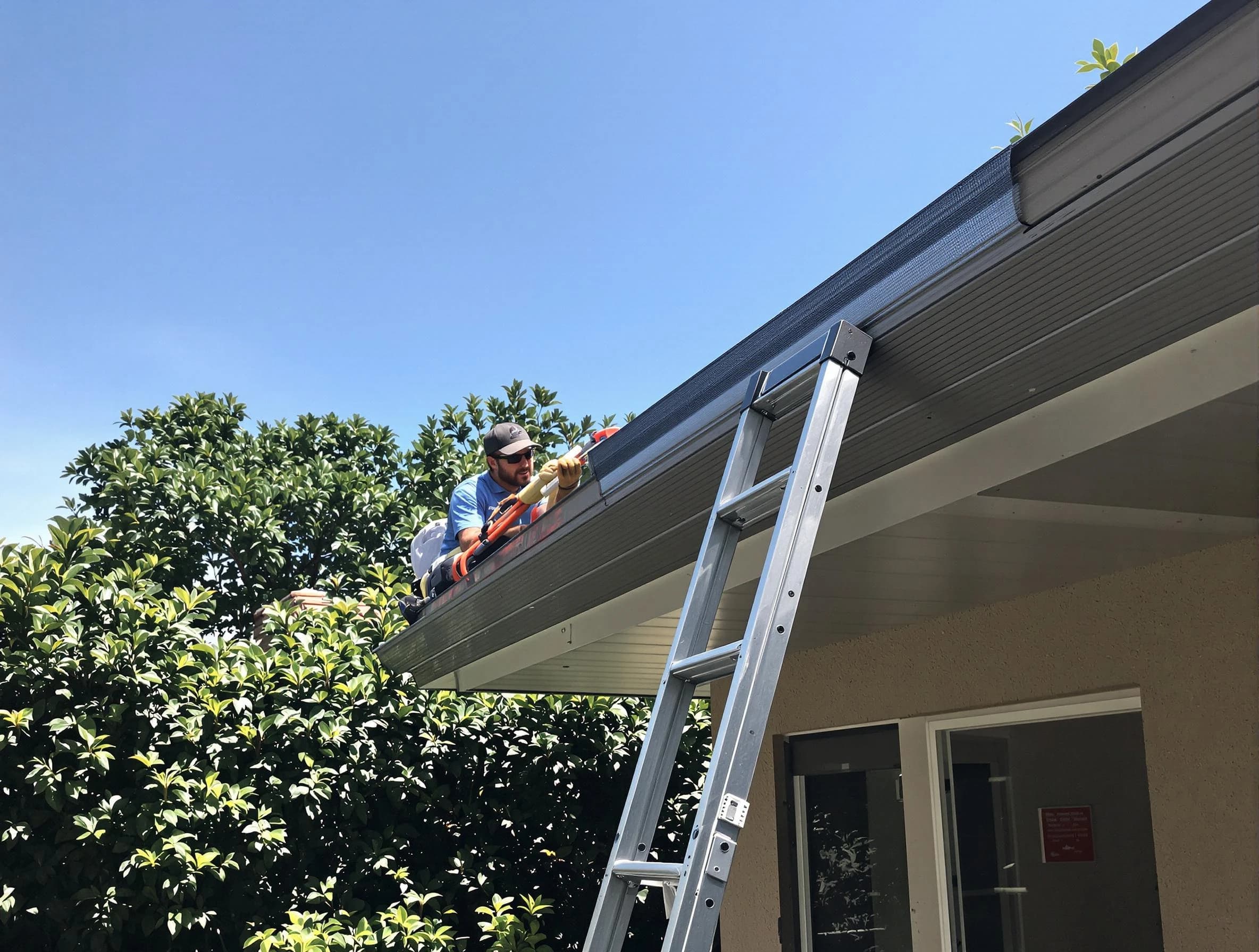 Mayfield Heights Roofing Company installing gutter guards for a homeowner in Mayfield Heights, OH